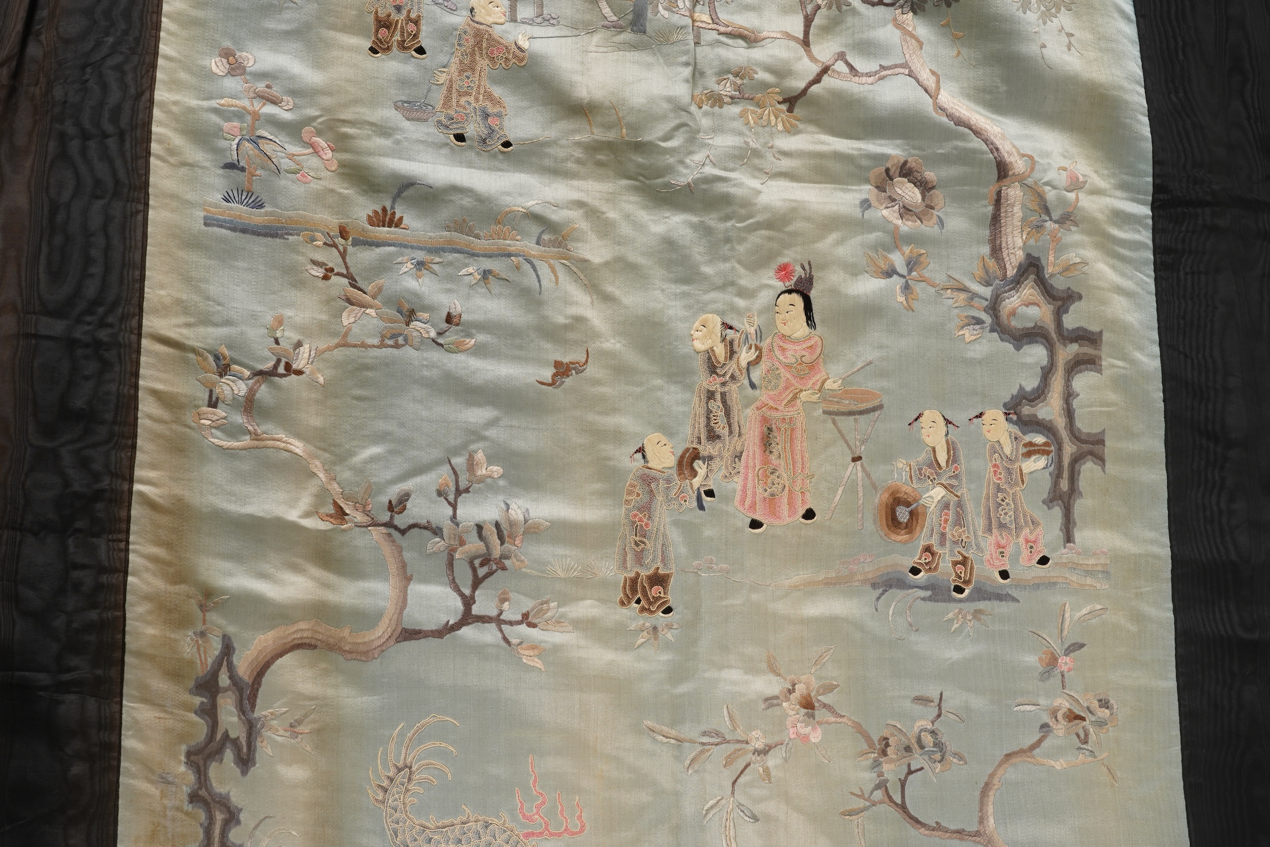 A Chinese embroidered silk ‘dragon dance’ panel, 18th/19th century